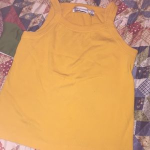 A yellow/mustard color T-shirt